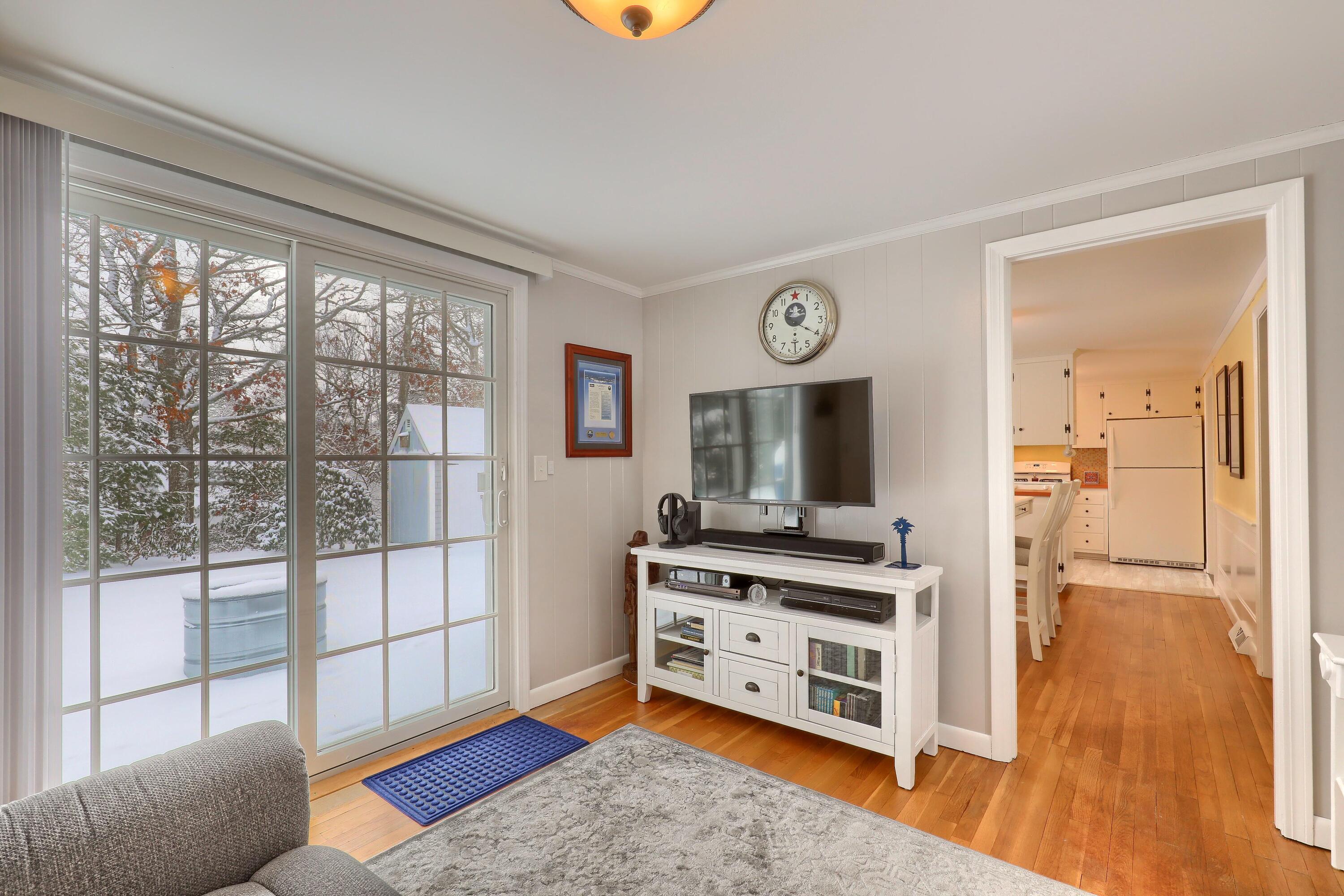 9 Captain Chase Road South Yarmouth, MA 02664 - Photo 10 of 28 a bedroom with furniture and a flat screen tv