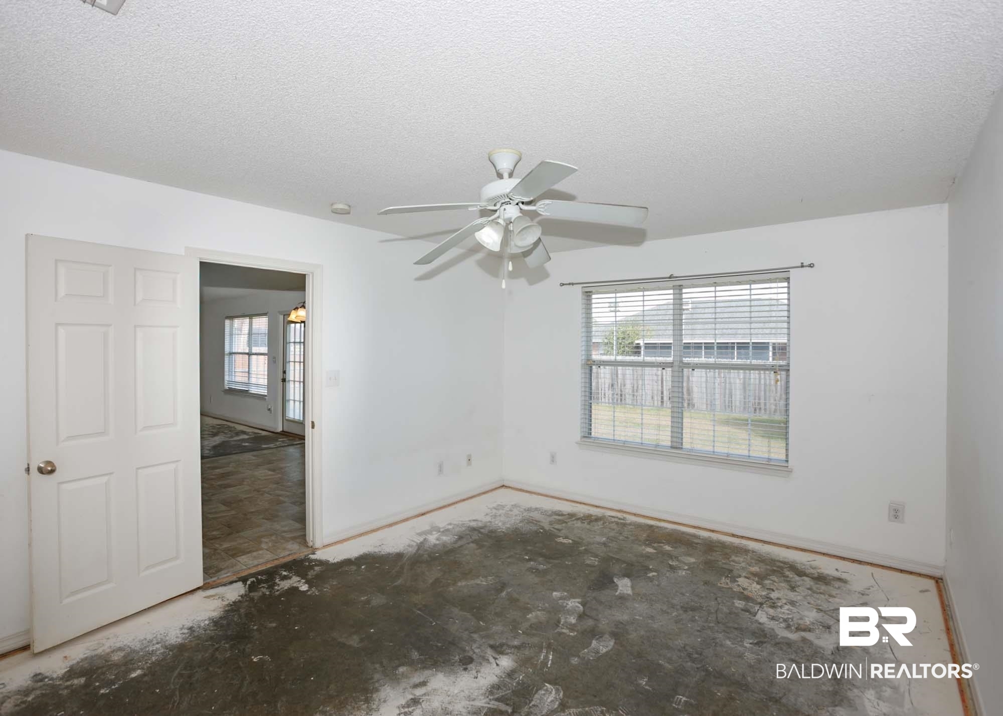 2530 Ashburn Lane Foley, AL 36535 - Photo 20 of 46 Spare room featuring ceiling fan, a textured ceiling, and a wealth of natural light