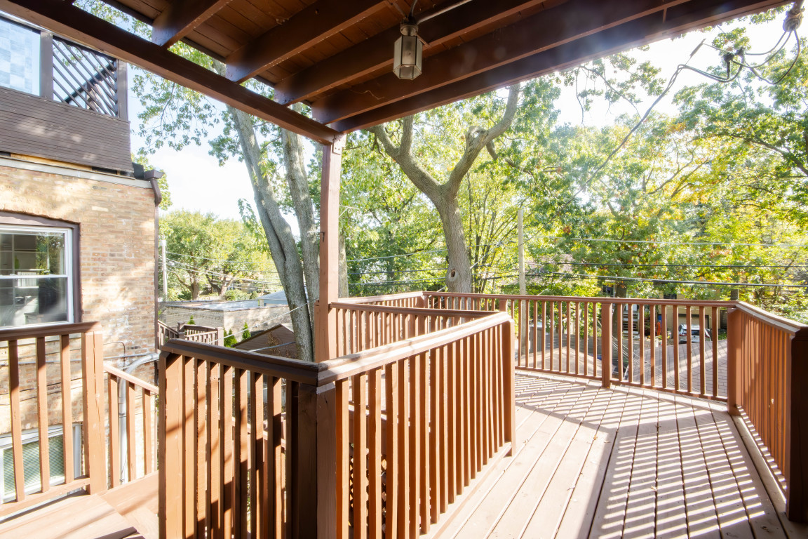 1122 Hull Terrace, Unit 2 Evanston, IL 60202 - Photo 15 of 17 a view of porch with wooden floor