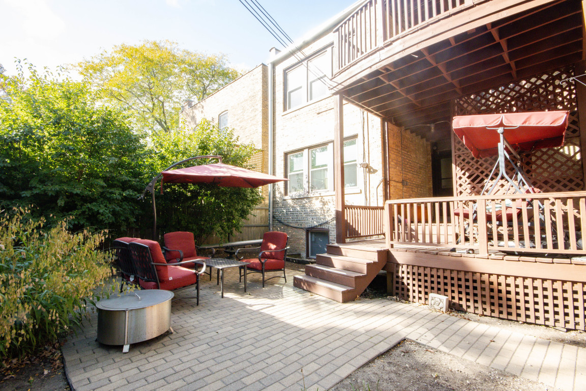 1122 Hull Terrace, Unit 2 Evanston, IL 60202 - Photo 17 of 17 a balcony with furniture and potted plants