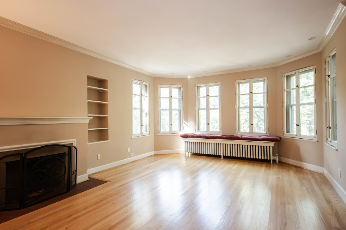 1122 Hull Terrace, Unit 2 Evanston, IL 60202 - Photo 5 of 17 wooden floor fireplace and windows in an empty room