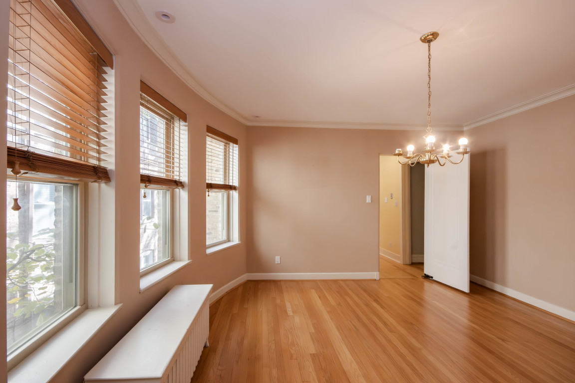 1122 Hull Terrace, Unit 2 Evanston, IL 60202 - Photo 6 of 17 a view of a room with wooden floor and windows