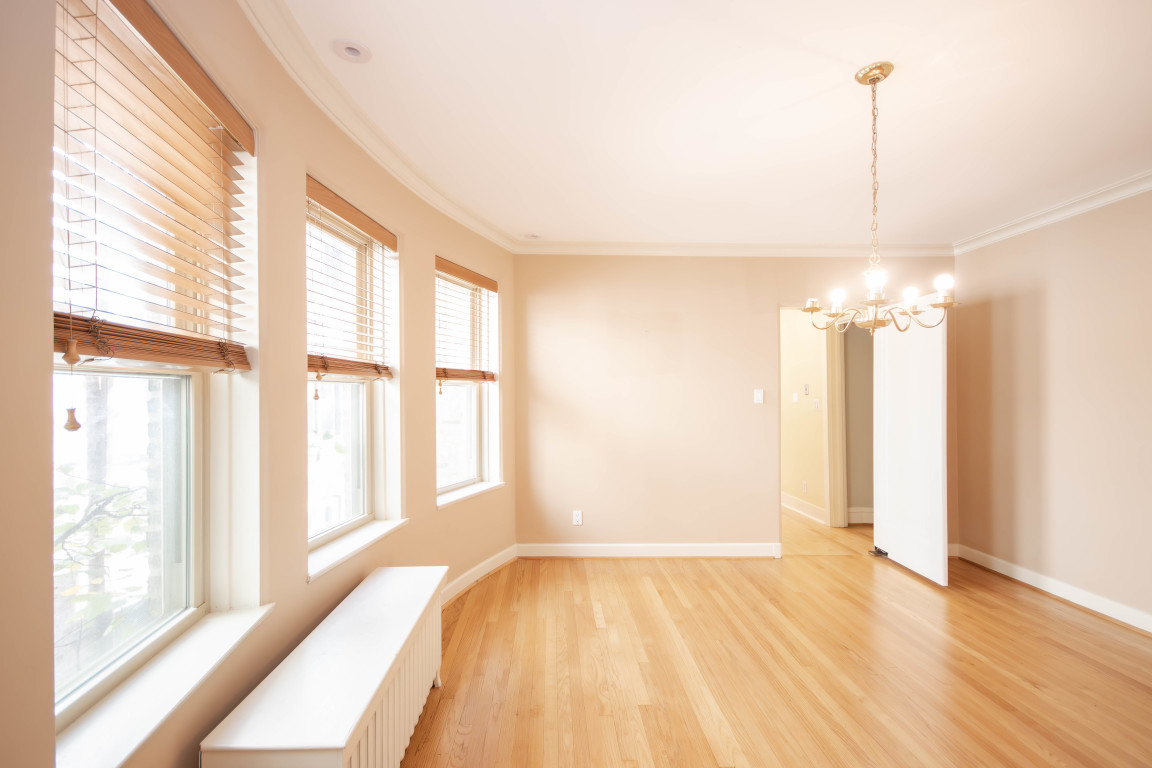 1122 Hull Terrace, Unit 2 Evanston, IL 60202 - Photo 8 of 17 a view of a room with wooden floor and windows