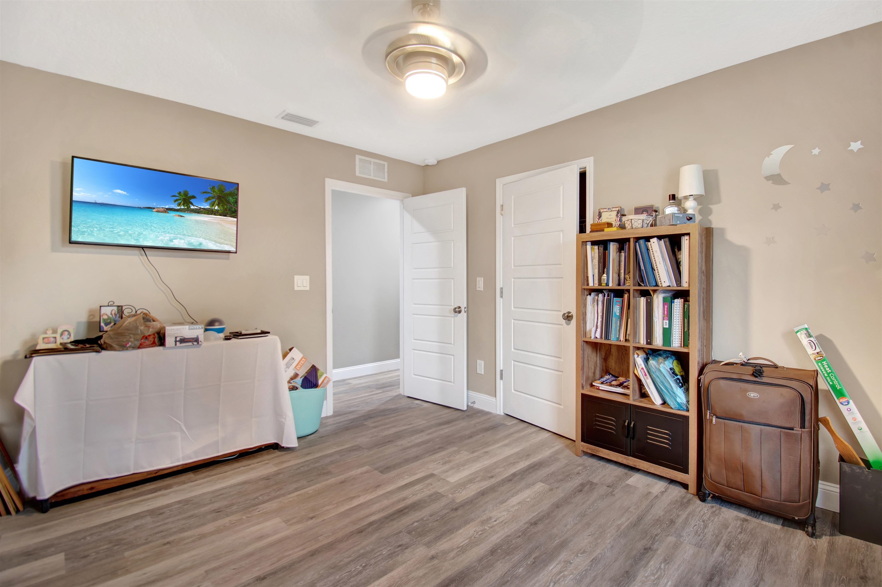 5831 Oak Street Elkton, FL 32033 - Photo 12 of 22 a living room with furniture and a book shelf