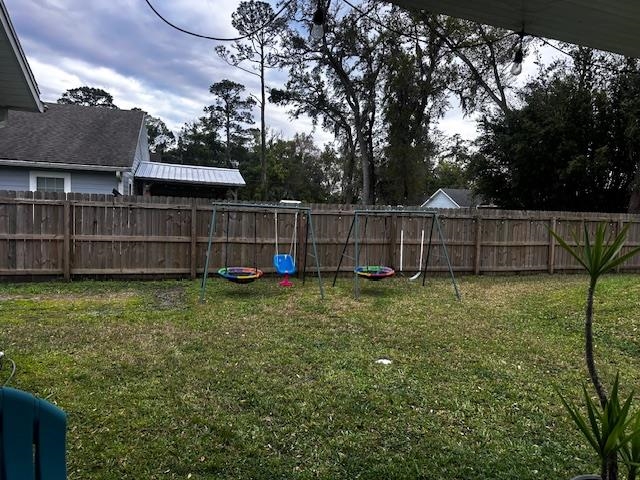 5831 Oak Street Elkton, FL 32033 - Photo 20 of 22 a view of backyard with wooden fence and large trees