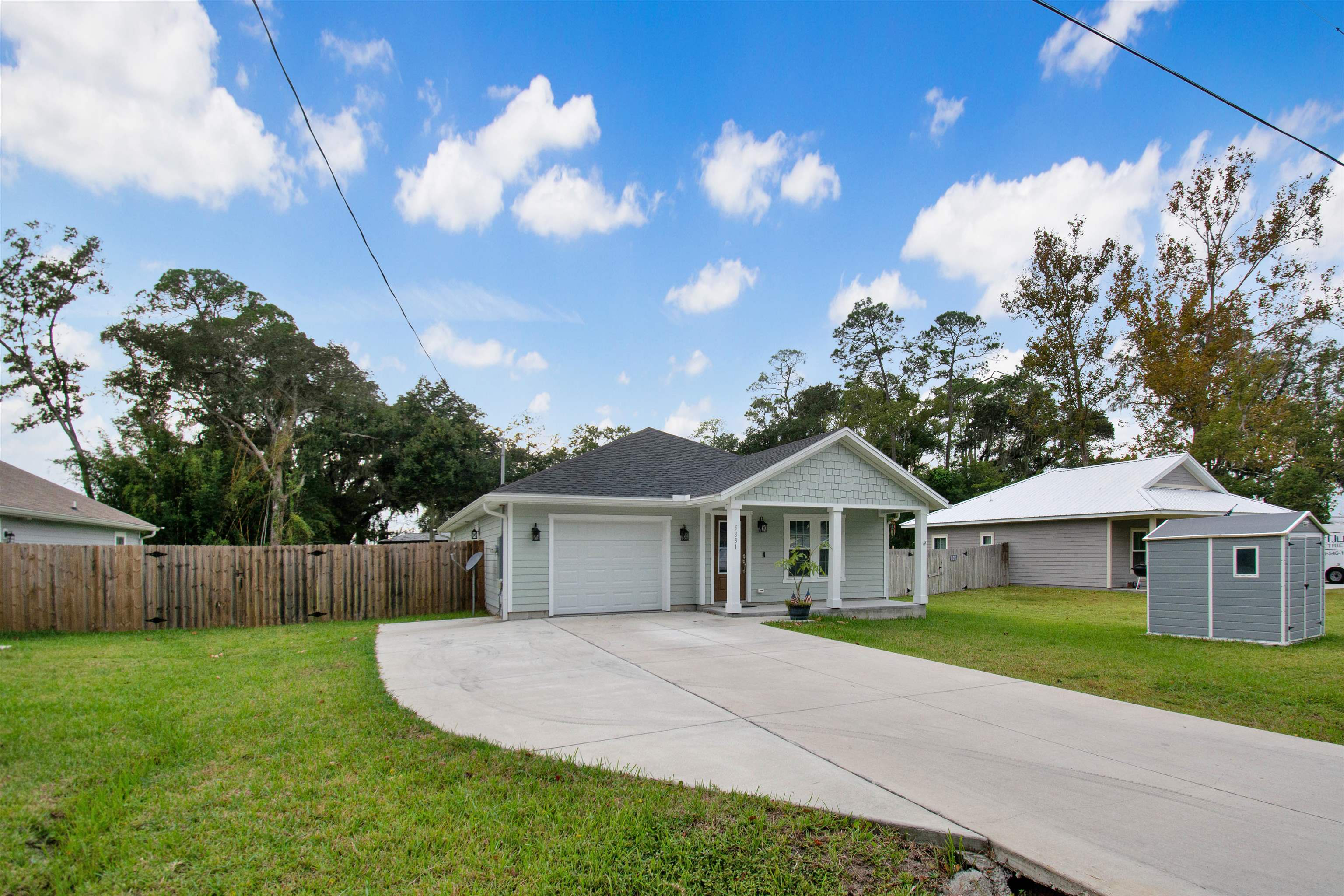 5831 Oak Street Elkton, FL 32033 - Photo 22 of 22 a front view of house with yard and green space