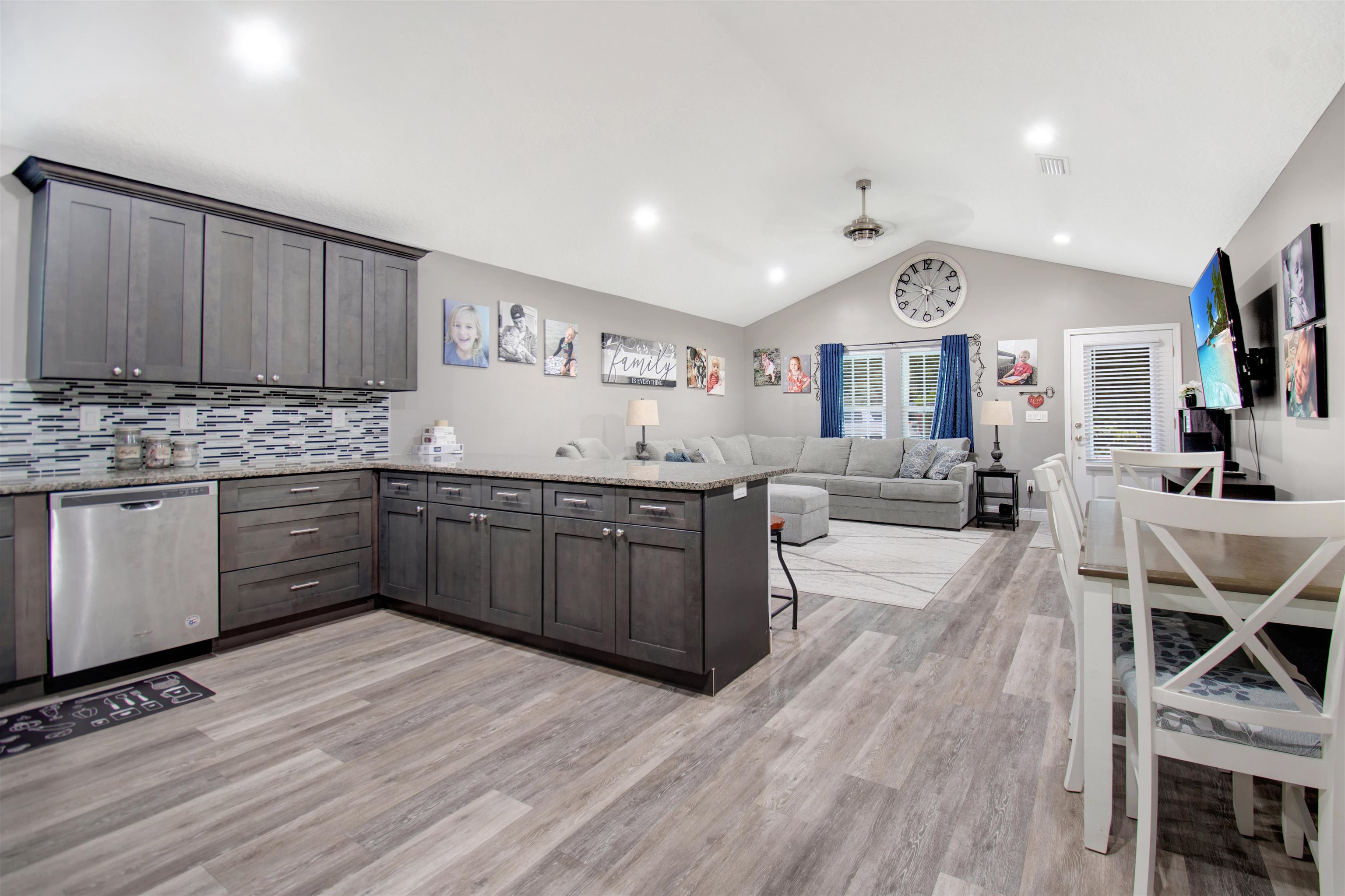 5831 Oak Street Elkton, FL 32033 - Photo 4 of 22 a kitchen with granite countertop a sink cabinets and wooden floor