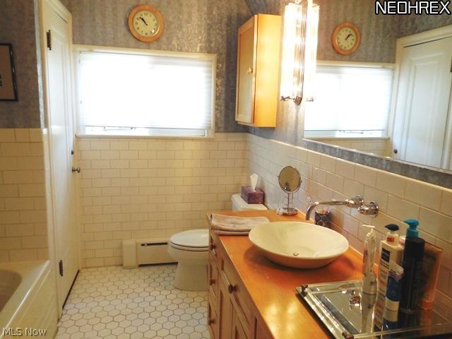 2889 Torrington Road Beachwood, OH 44122 - Photo 14 of 25 The Updated Main Bath has separate shower and Jacuzzi tub, subway tile, ceramic floor and newer maple vanity and sink.