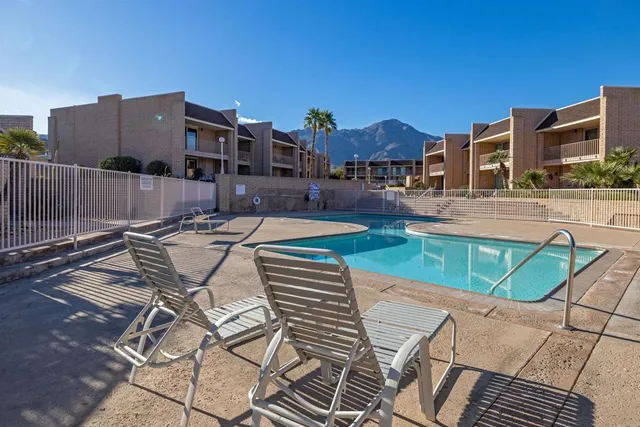 a view of a patio with couches table and chairs