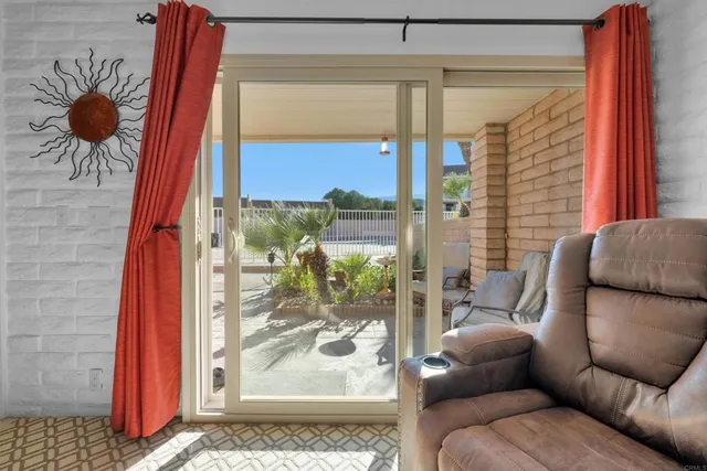 a view of a living room filled with furniture