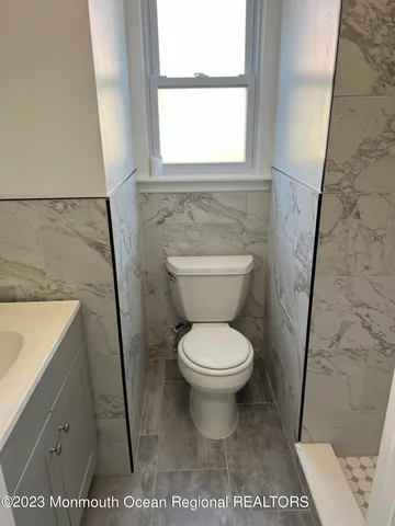 a bathroom with a toilet and a sink