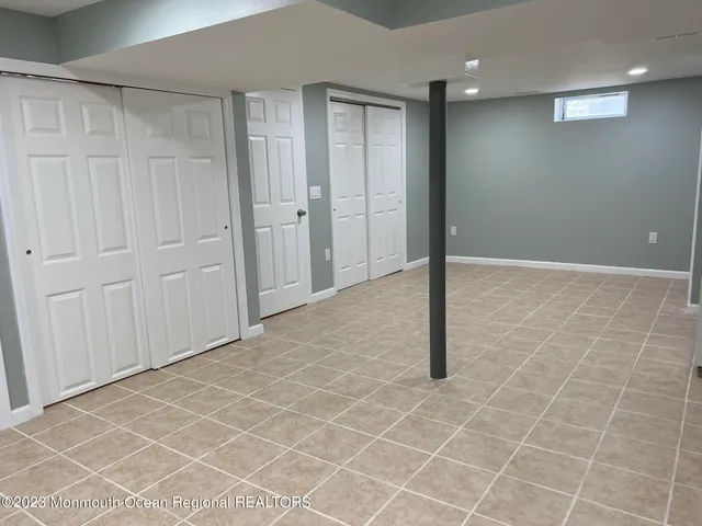 an empty room with wooden floor