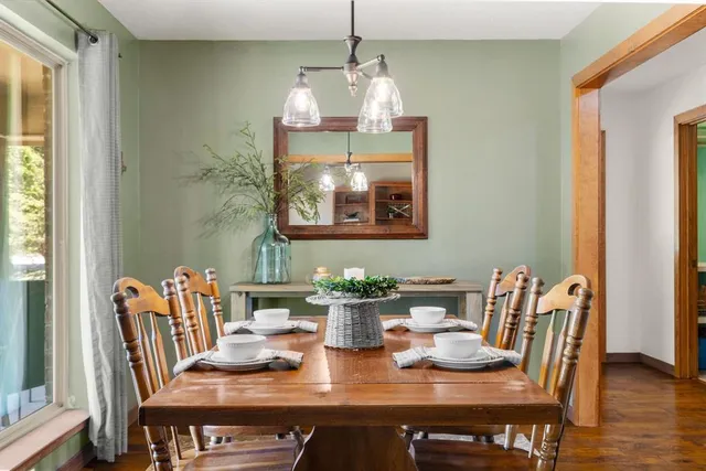 a view of a dining room with furniture window and wooden floor