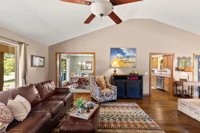 a living room with furniture and a rug