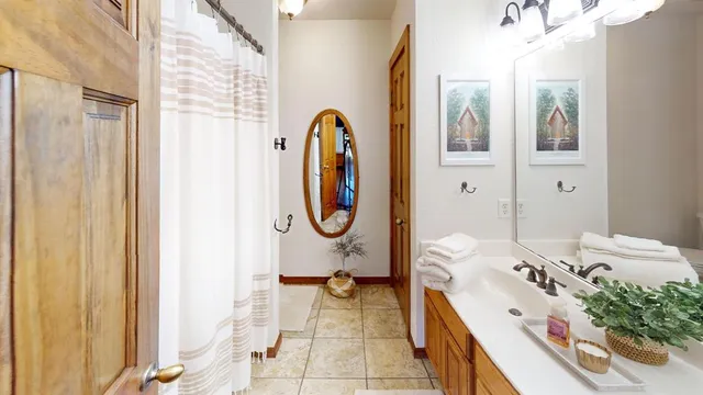 a room with a bed and a chandelier