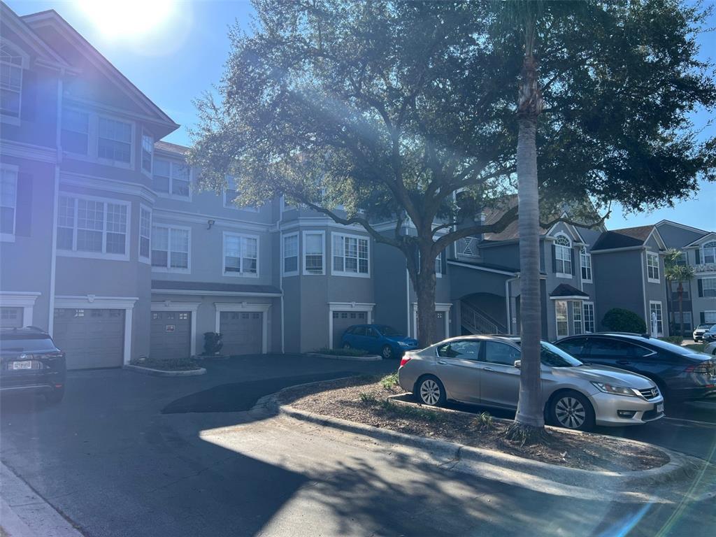 a view of a car parked in the street