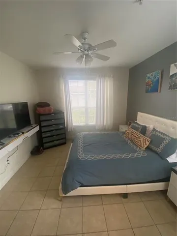a living room with hard wood flooring and a couch