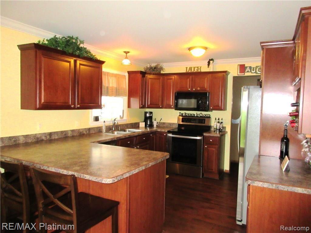 1802 Clover Ridge Drive Howell, MI 48843 - Photo 5 of 22 Newer Hardwood Floors