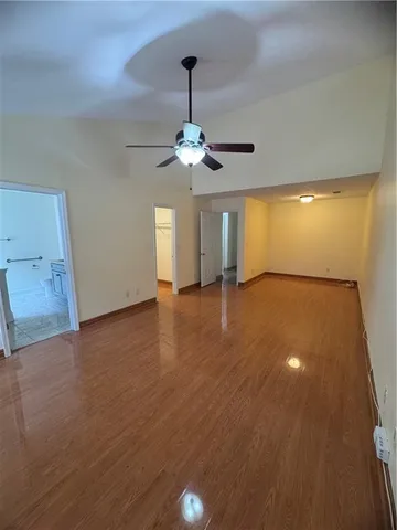 a view of a livingroom with a ceiling fan window and a chandelier