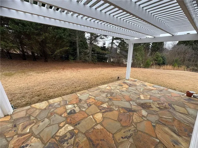 a view of backyard with green space