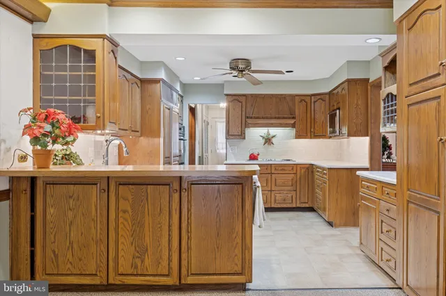 a kitchen with sink cabinets and refrigerator