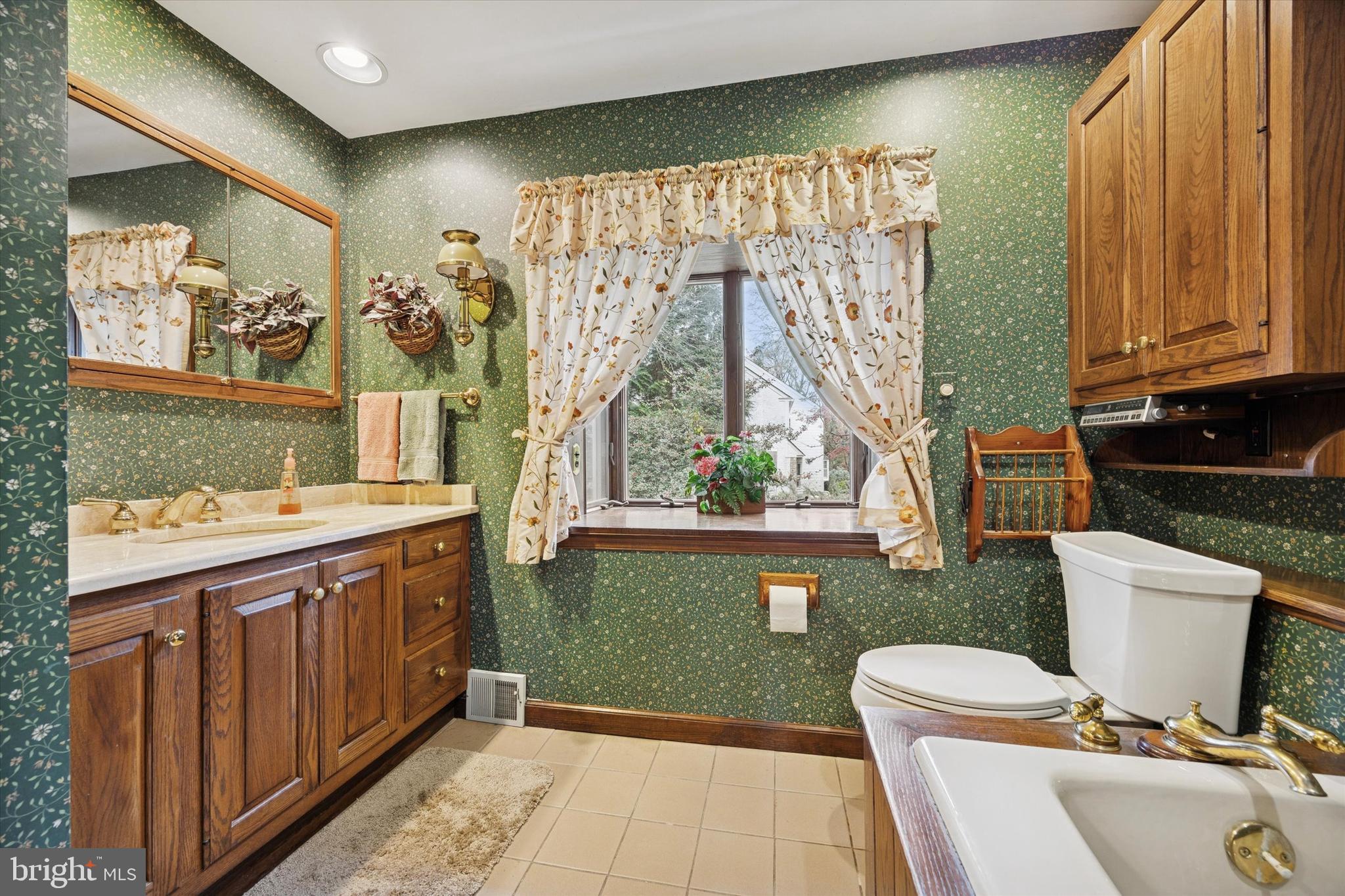 1162 Limekiln Pike Ambler, PA 19002 - Photo 28 of 56 a bathroom with a sink a mirror and a shower