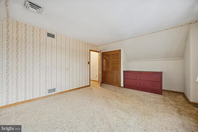 a view of entryway with wooden floor and door