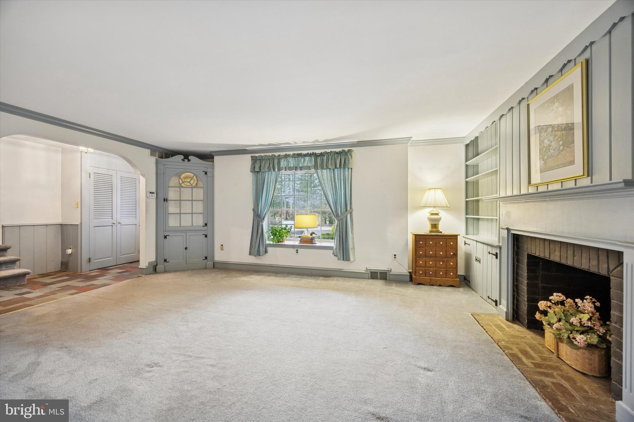 1162 Limekiln Pike Ambler, PA 19002 - Photo 10 of 56 a view of a livingroom with a fireplace and window