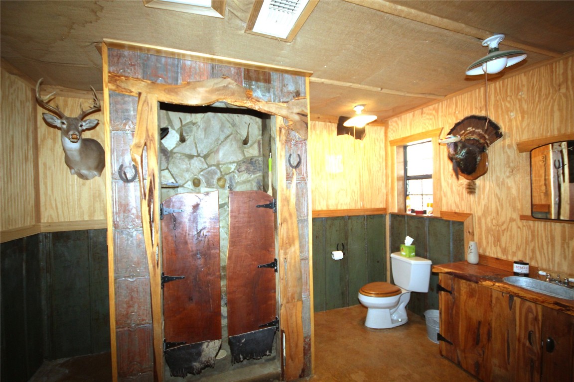 51 Dead End Rd Mountain Junction, TX 76849 - Photo 11 of 32 a bathroom with a toilet a sink and shower