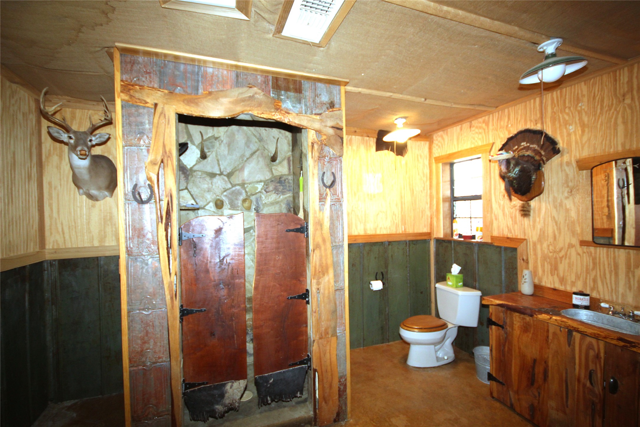 51 Dead End Rd Mountain Junction, TX 76849 - Photo 11 of 32 a bathroom with a toilet a sink and shower