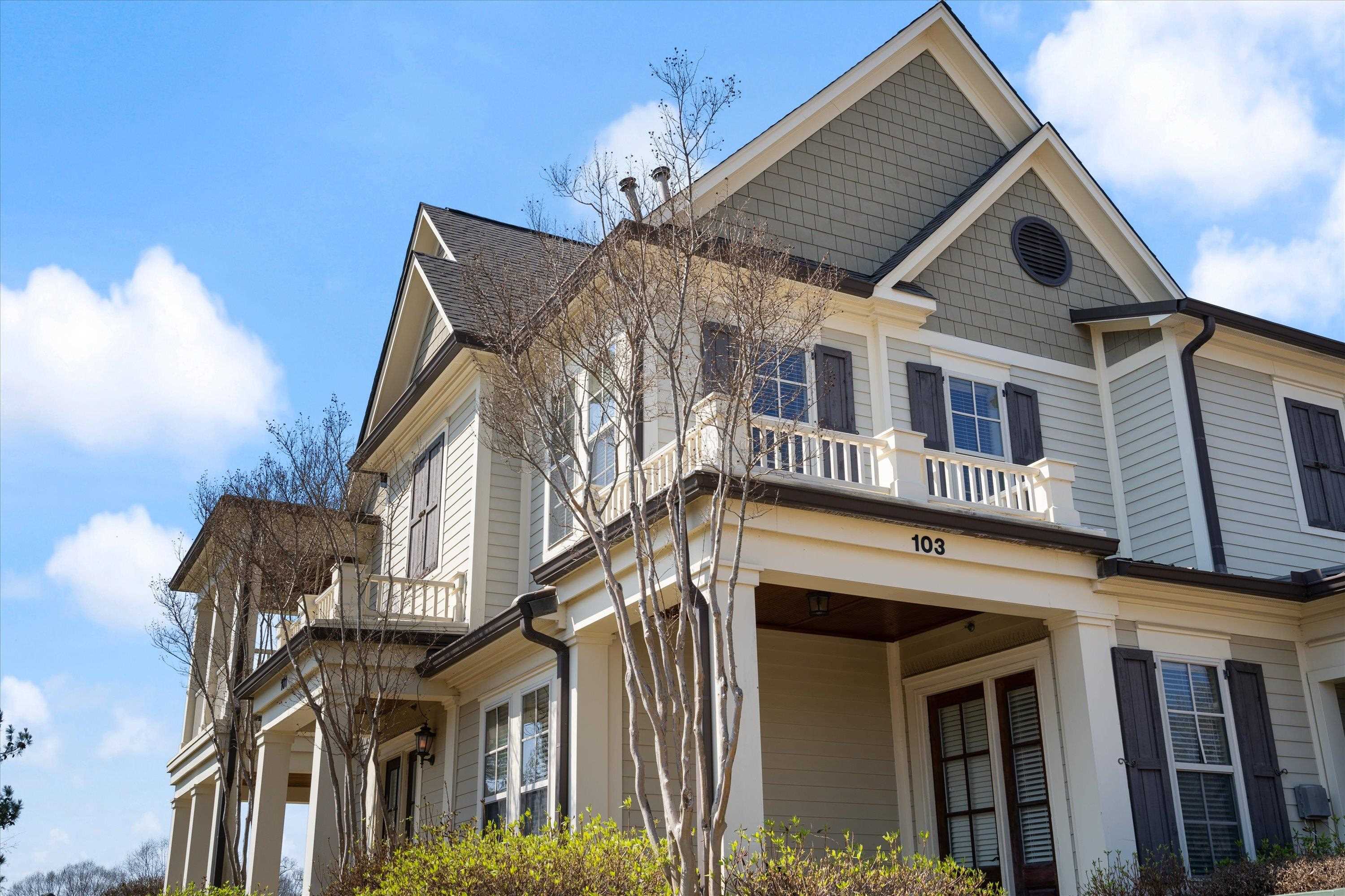1100 Augusta Drive, Unit 103 Oxford, MS 38655 - Photo 1 of 24 a front view of a house with a yard