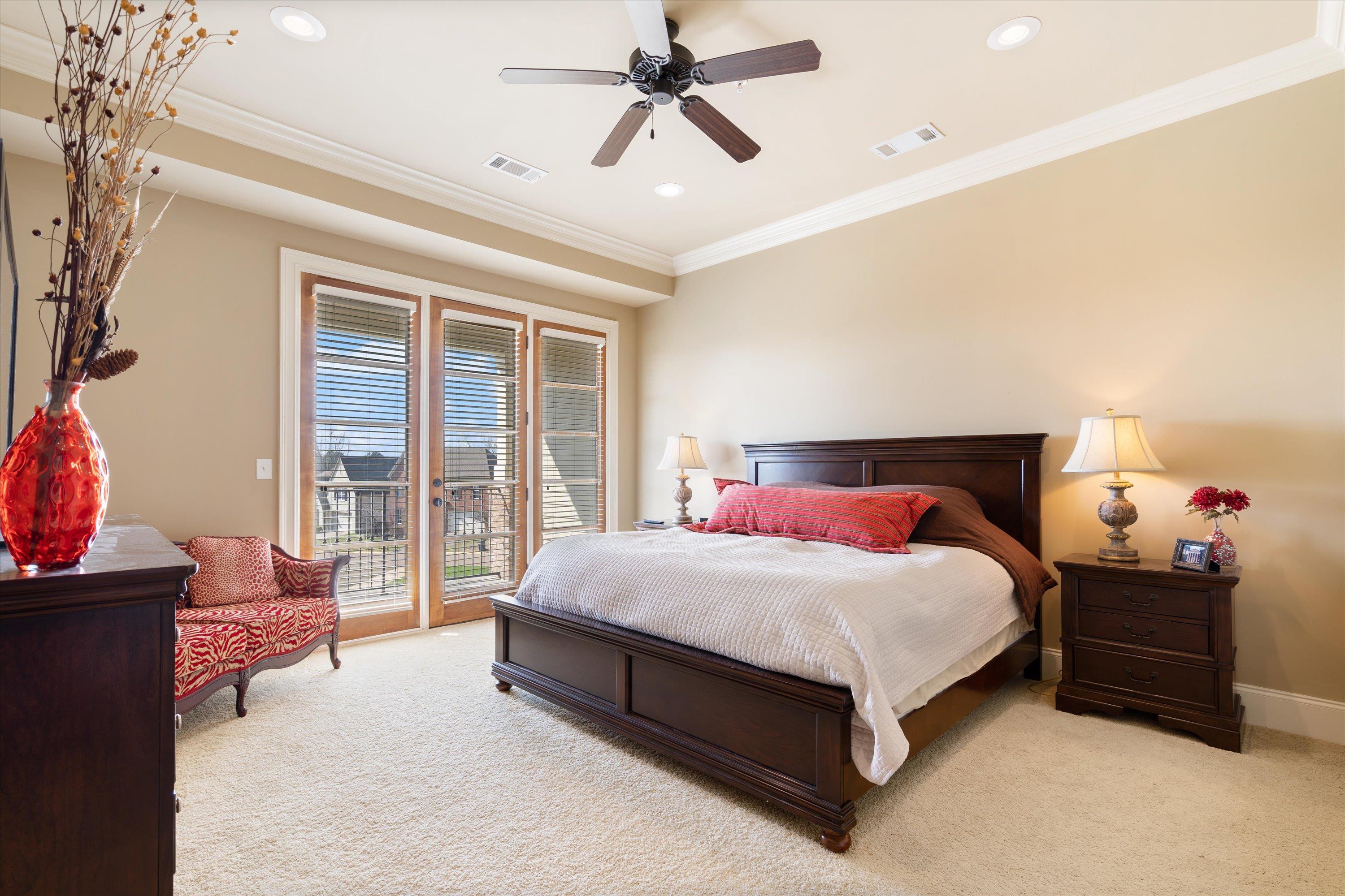 1100 Augusta Drive, Unit 103 Oxford, MS 38655 - Photo 12 of 24 a bedroom with a bed couch and a window