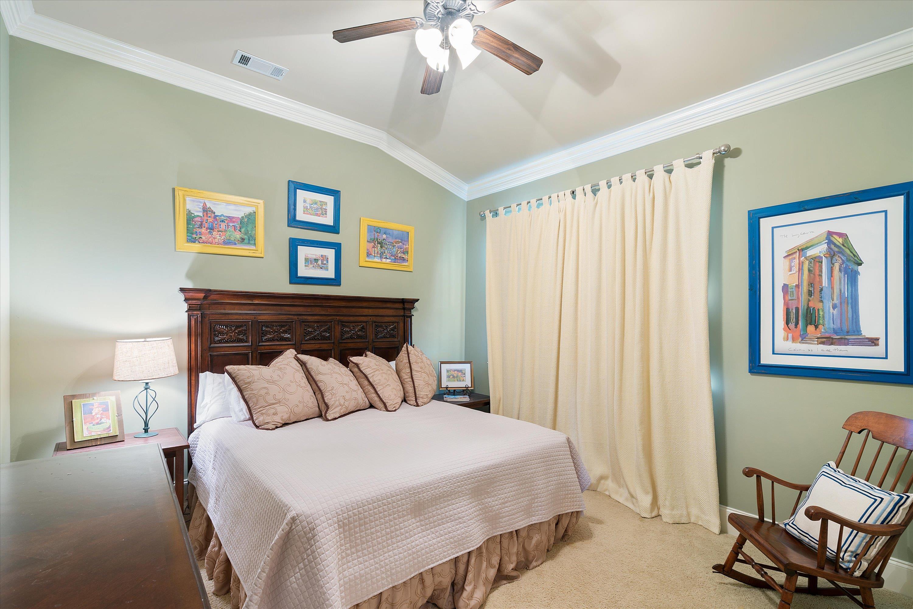 1100 Augusta Drive, Unit 103 Oxford, MS 38655 - Photo 15 of 24 a bedroom with a bed and a chandelier