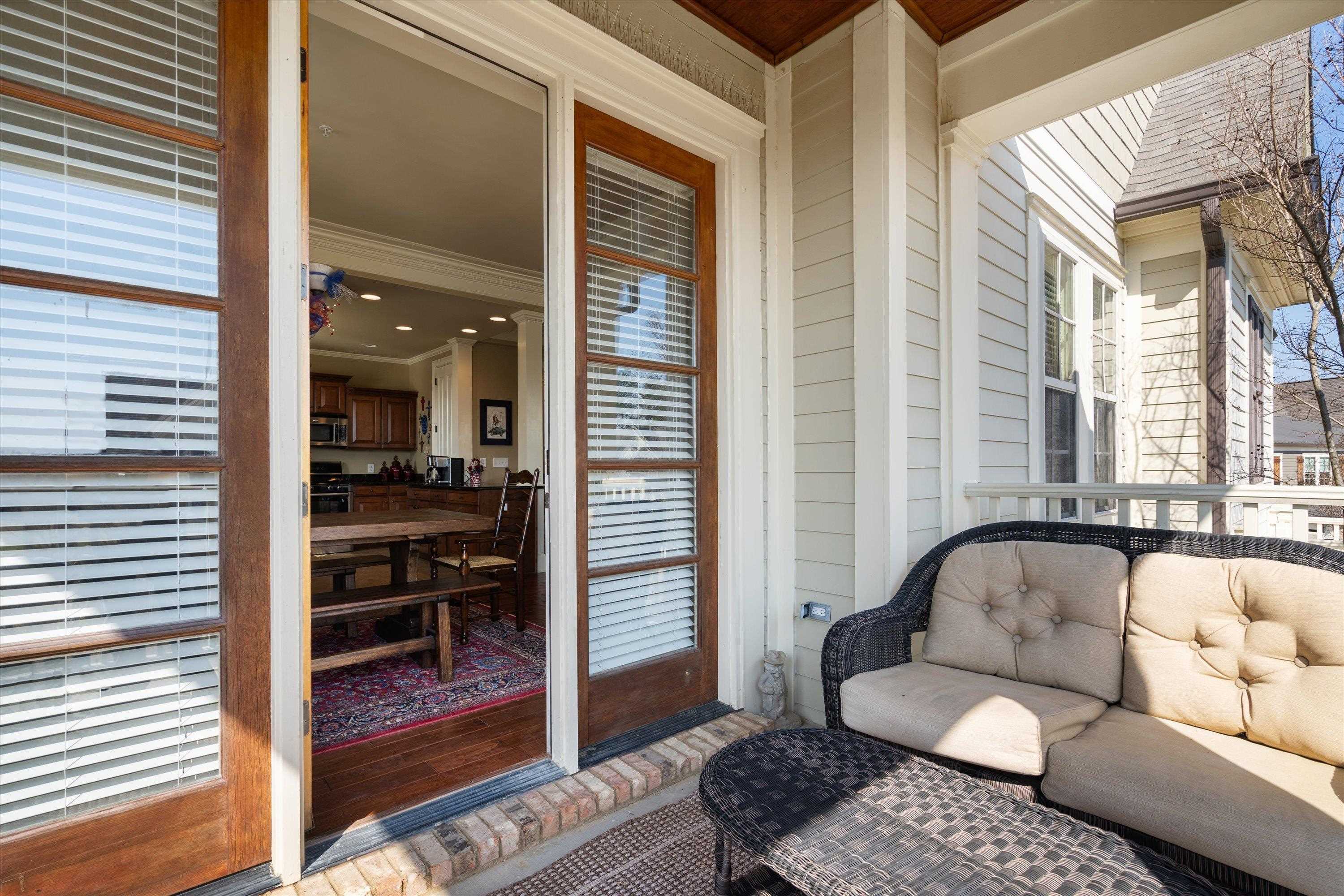 1100 Augusta Drive, Unit 103 Oxford, MS 38655 - Photo 20 of 24 a living room with furniture and a large window