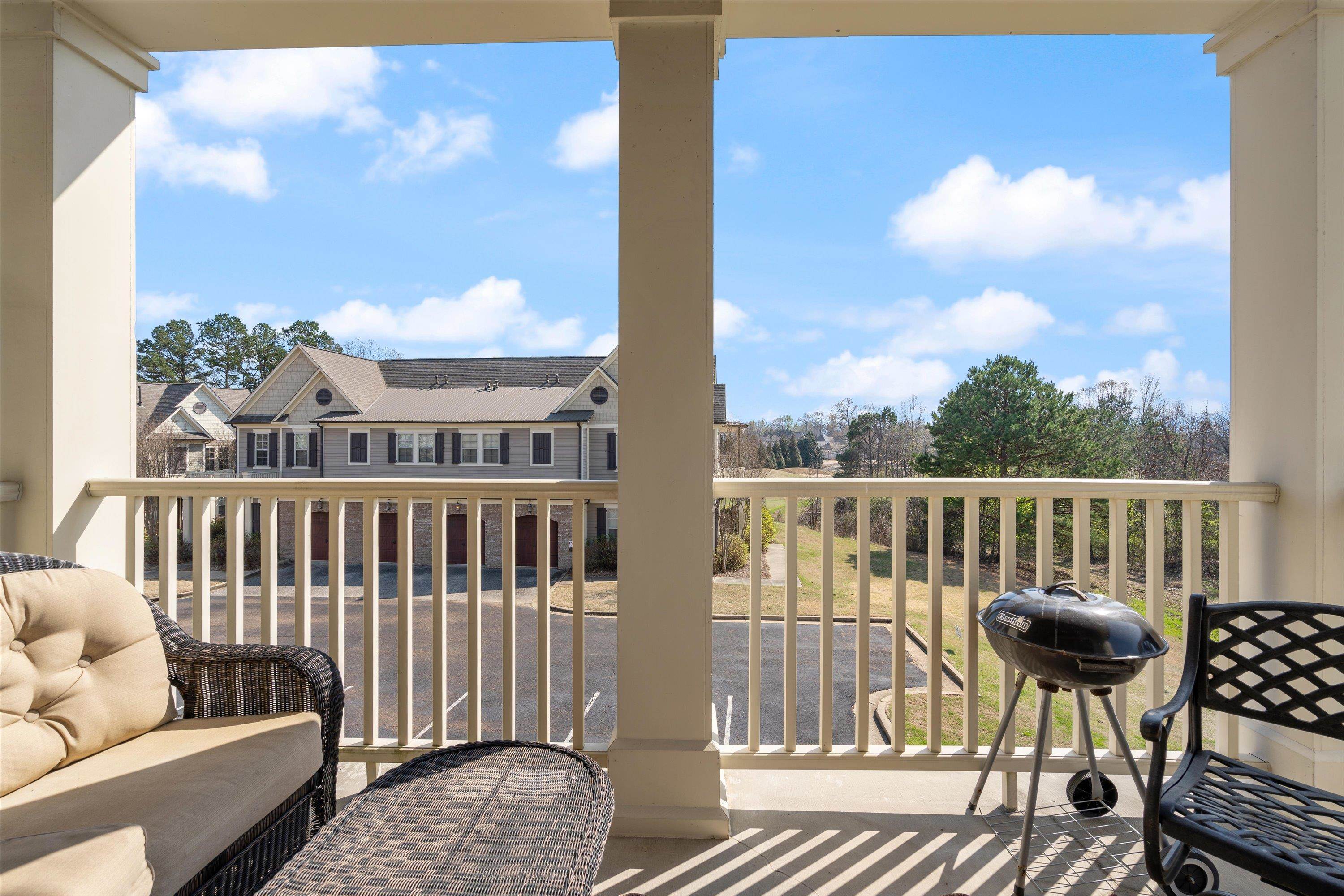 1100 Augusta Drive, Unit 103 Oxford, MS 38655 - Photo 21 of 24 a view of roof deck with chair and wooden floor