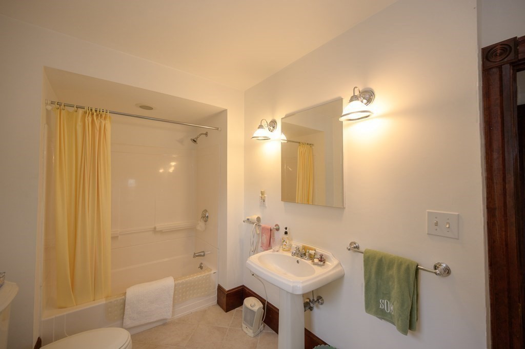 896 Sandwich Road Bourne, MA 02561 - Photo 29 of 41 a bathroom with a sink a toilet and shower