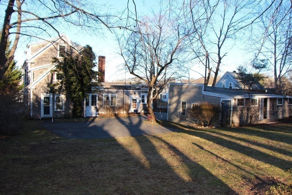 896 Sandwich Road Bourne, MA 02561 - Photo 7 of 41 a view of a house with a yard