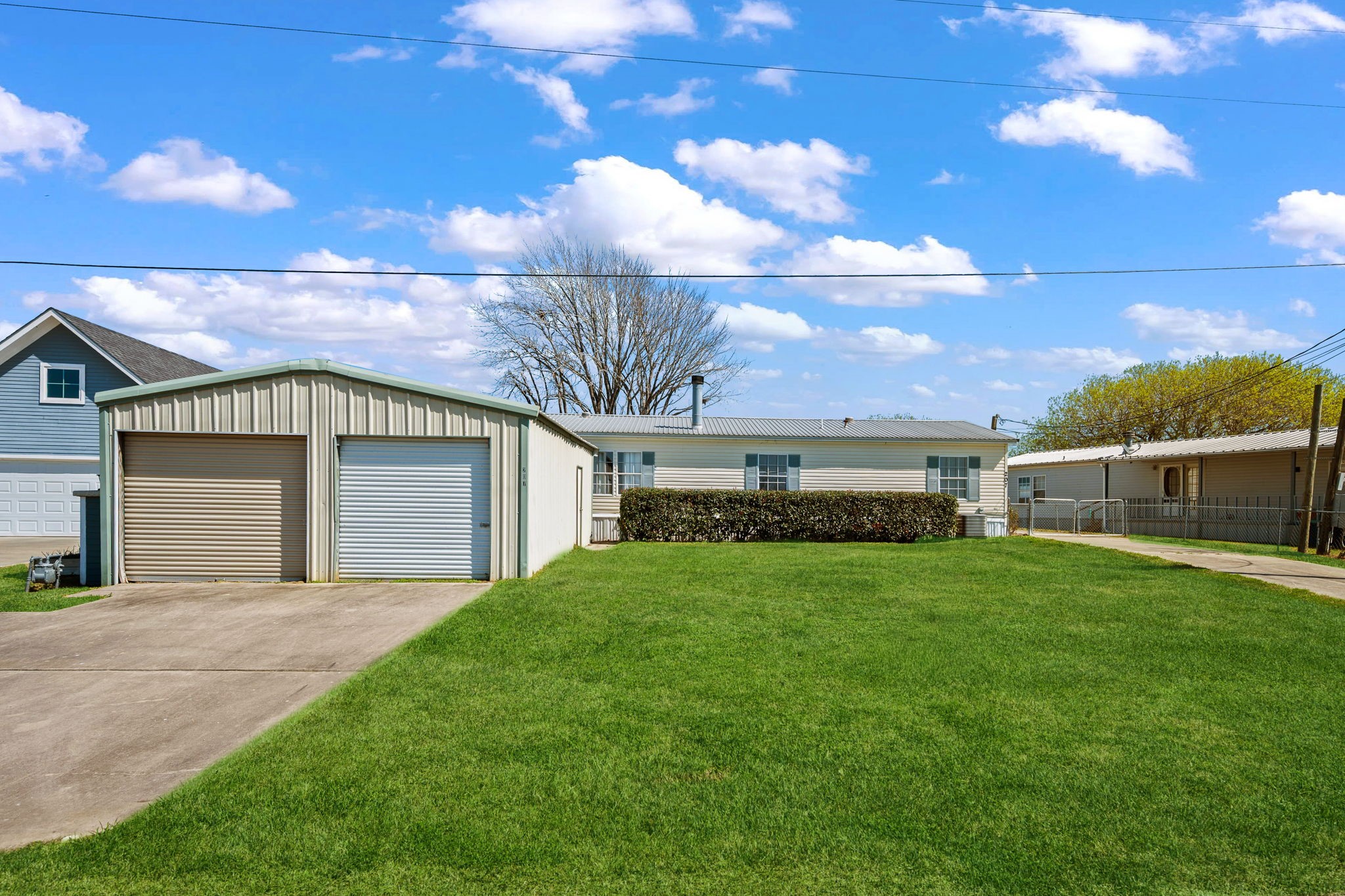 207 Vivian Road Onalaska, TX 77360 - Photo 13 of 33 a front view of a house with a yard and garage