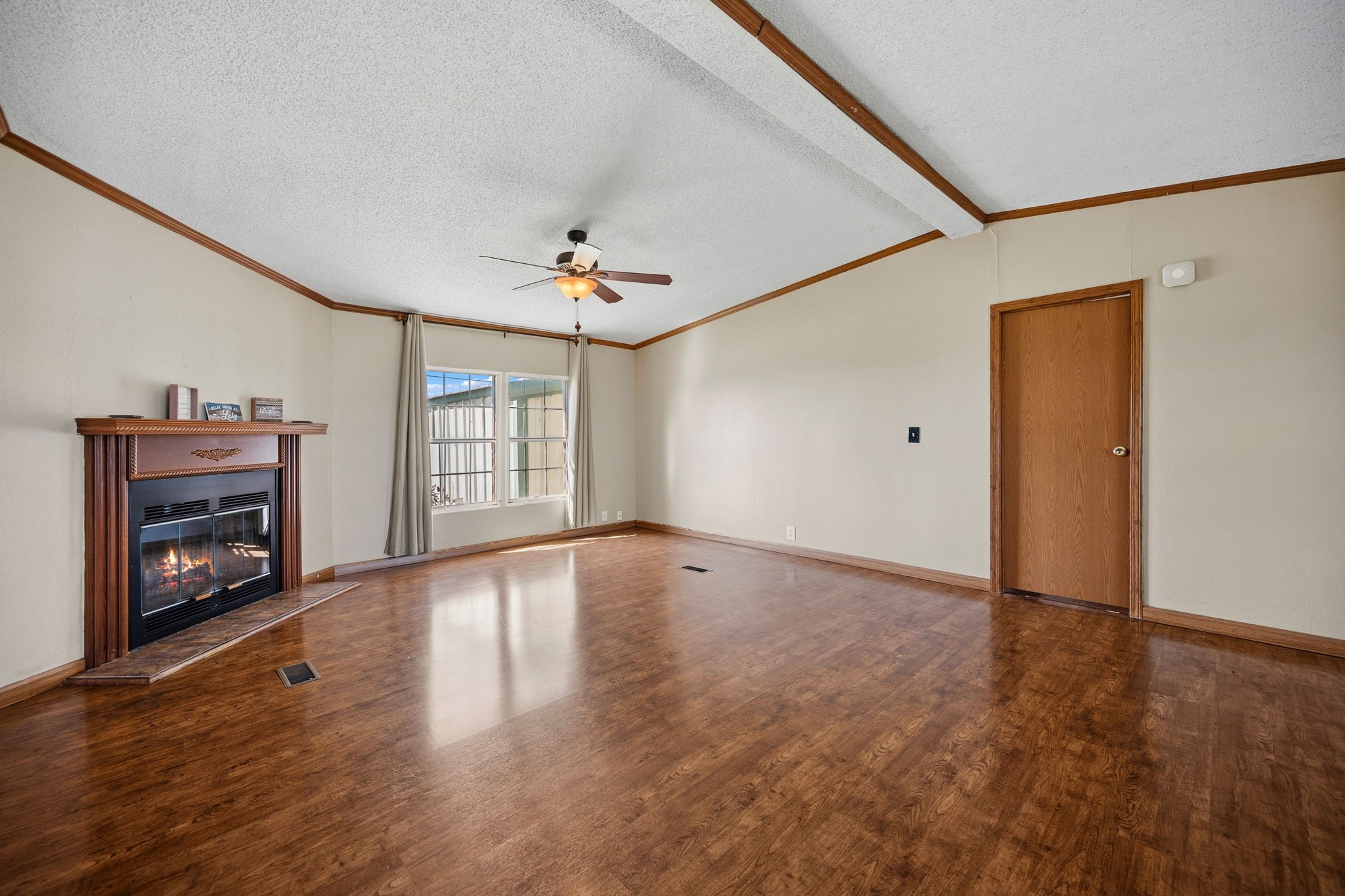 207 Vivian Road Onalaska, TX 77360 - Photo 15 of 33 a view of an empty room with a fireplace and a window
