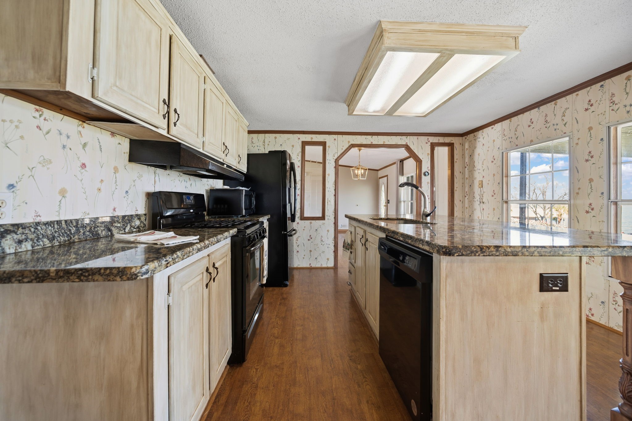 207 Vivian Road Onalaska, TX 77360 - Photo 20 of 33 a kitchen with stainless steel appliances granite countertop a stove and a refrigerator