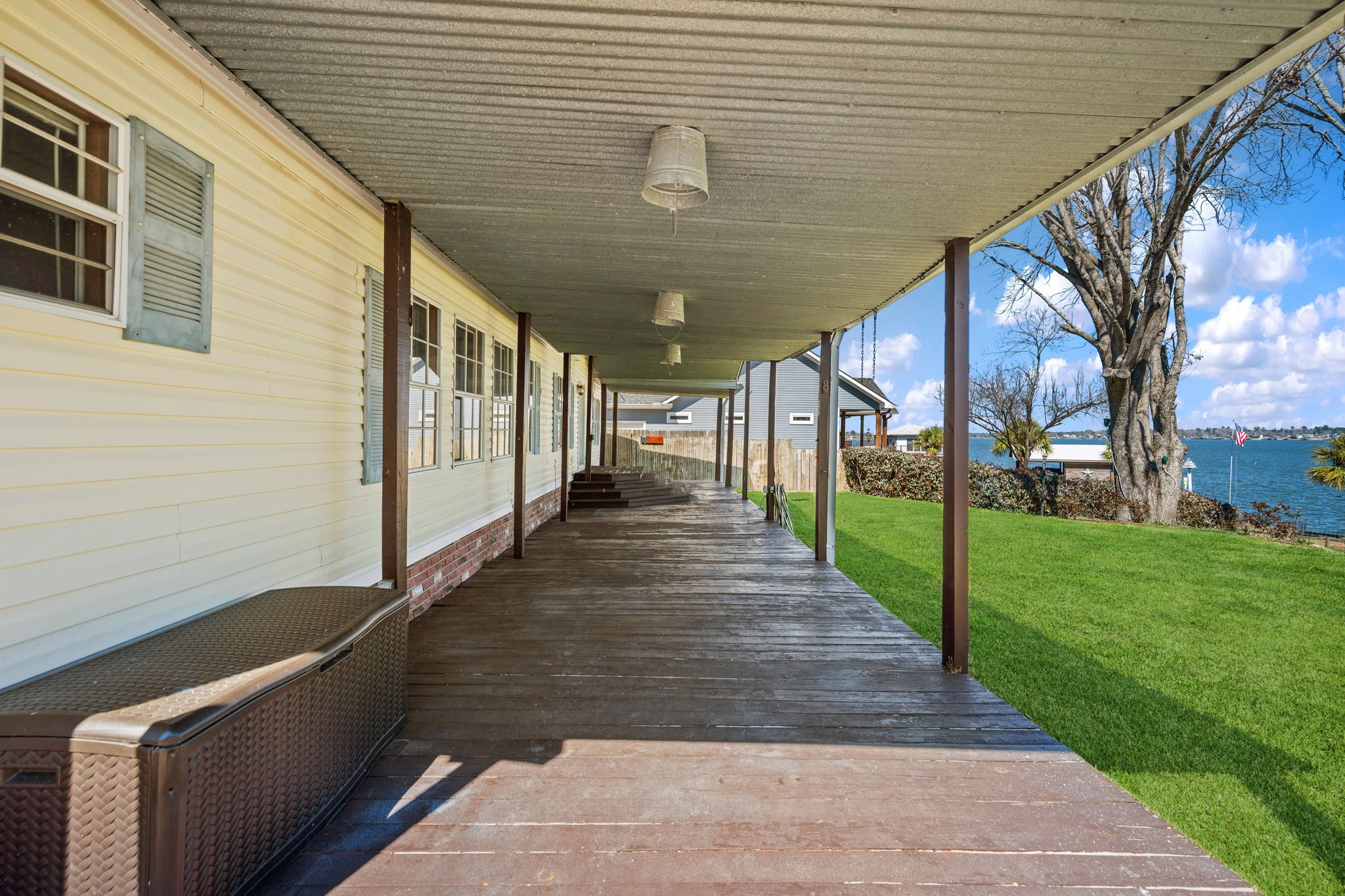 207 Vivian Road Onalaska, TX 77360 - Photo 2 of 33 Expansive back porch overlooks the wide open water! Whether you're enjoying your morning coffee or an evening cocktail, the view can't be beat.