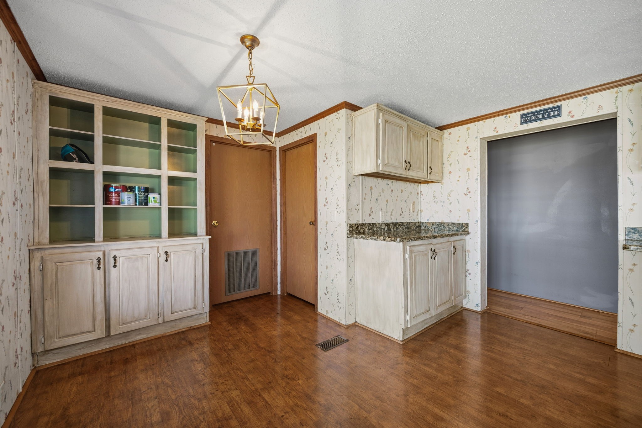 207 Vivian Road Onalaska, TX 77360 - Photo 22 of 33 a kitchen with white cabinets and white appliances