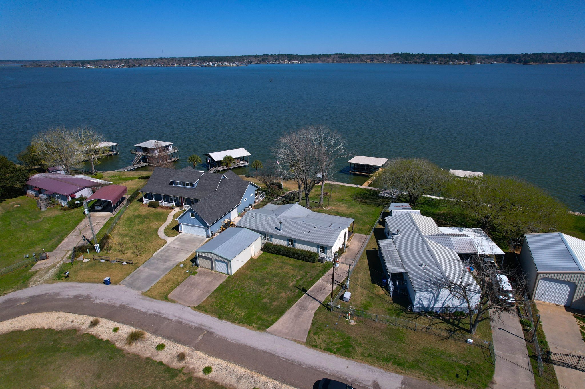 207 Vivian Road Onalaska, TX 77360 - Photo 4 of 33 an aerial view of a house with outdoor space and lake view
