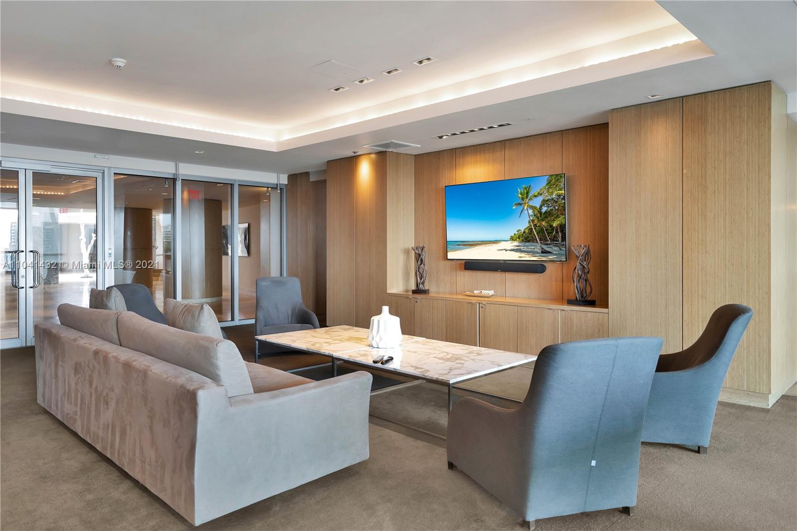 900 Biscayne Boulevard, Unit 6301 Miami, FL 33132 - Photo 17 of 72 a living room with furniture and a flat screen tv