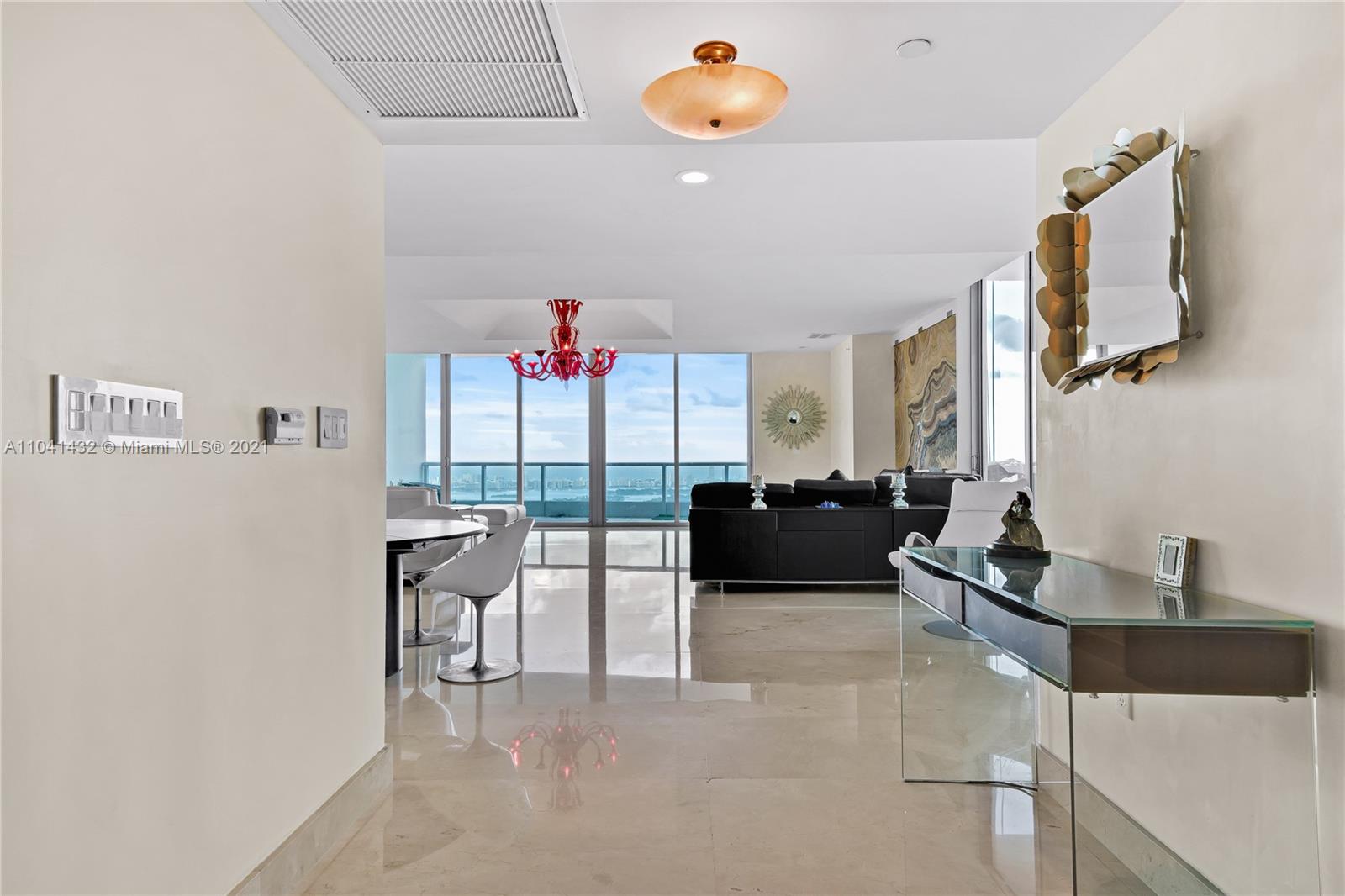 900 Biscayne Boulevard, Unit 6301 Miami, FL 33132 - Photo 22 of 72 a living room with furniture and a chandelier