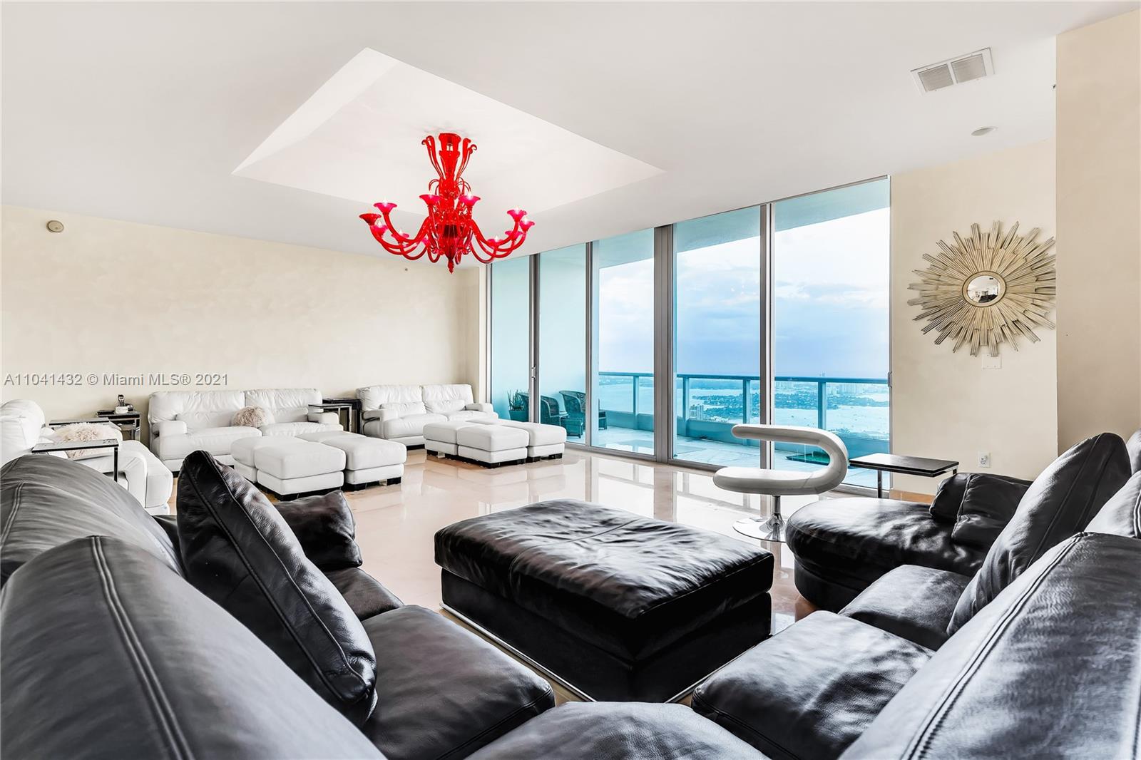 900 Biscayne Boulevard, Unit 6301 Miami, FL 33132 - Photo 27 of 72 a living room with furniture and floor to ceiling window