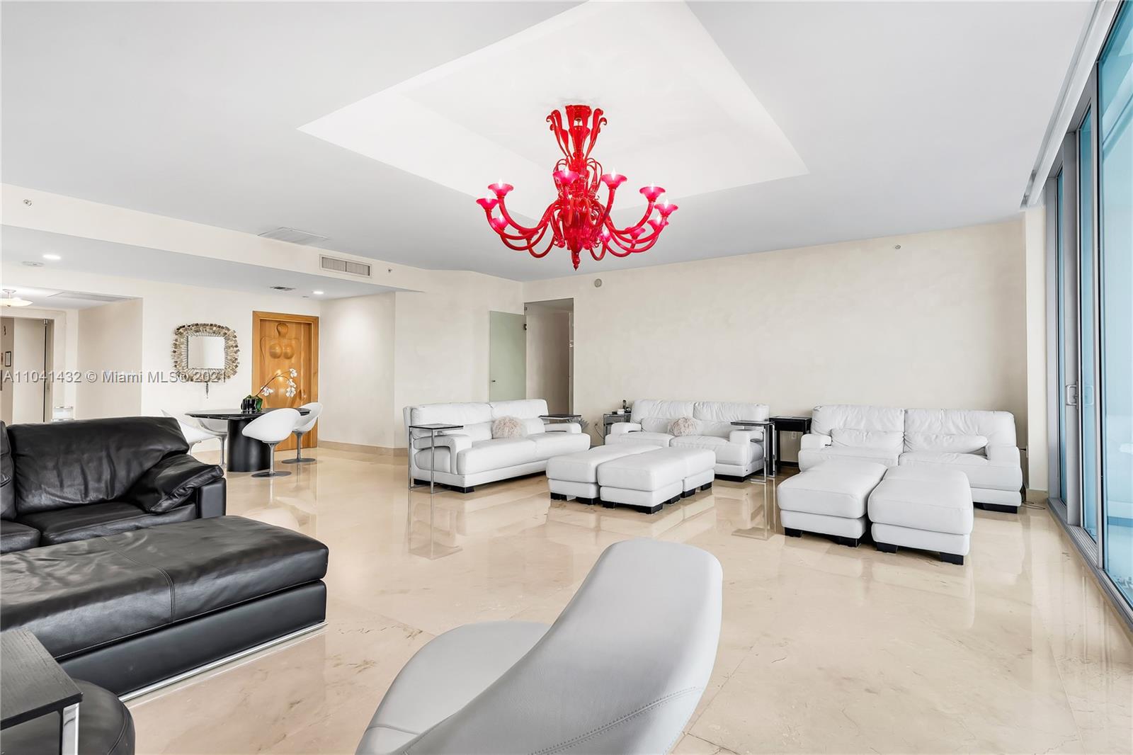 900 Biscayne Boulevard, Unit 6301 Miami, FL 33132 - Photo 29 of 72 a living room with furniture and a chandelier