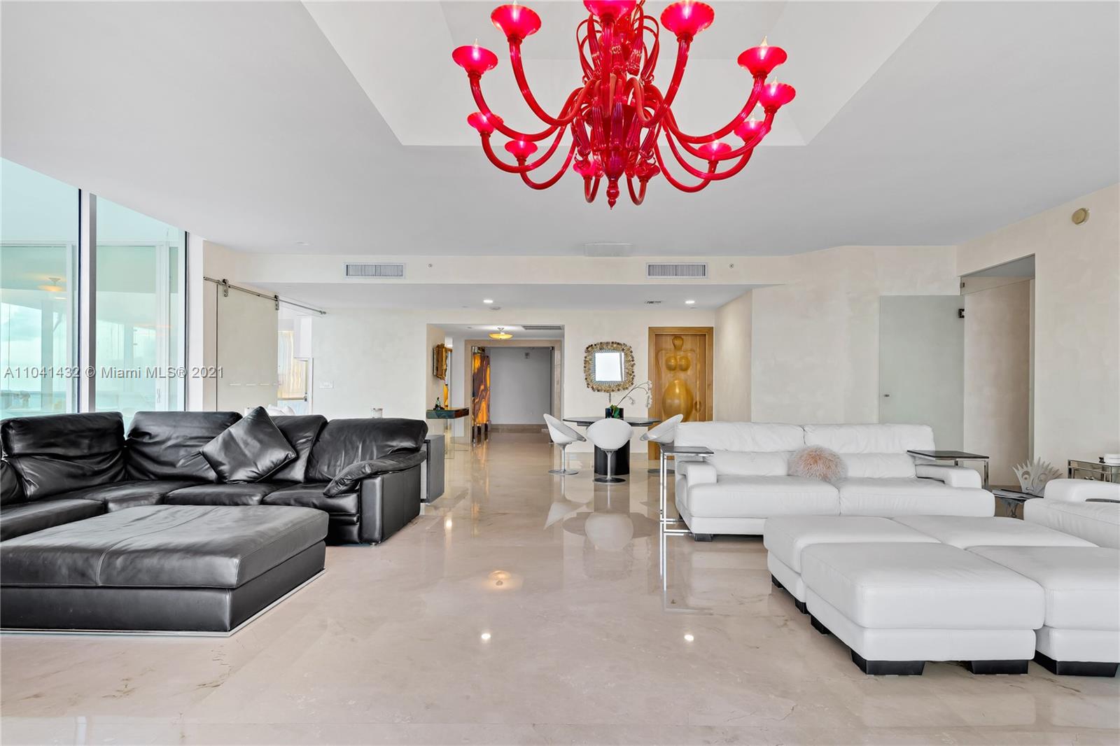 900 Biscayne Boulevard, Unit 6301 Miami, FL 33132 - Photo 30 of 72 a living room with furniture a couch and a window