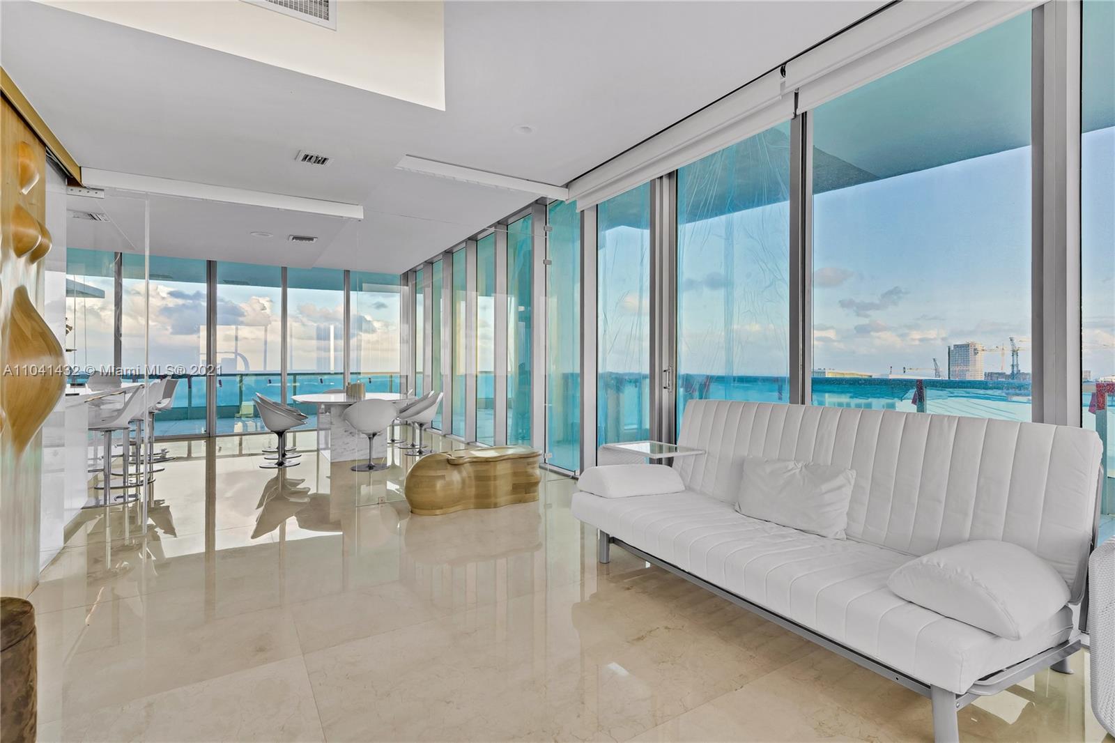 900 Biscayne Boulevard, Unit 6301 Miami, FL 33132 - Photo 35 of 72 a living room with furniture and a large window