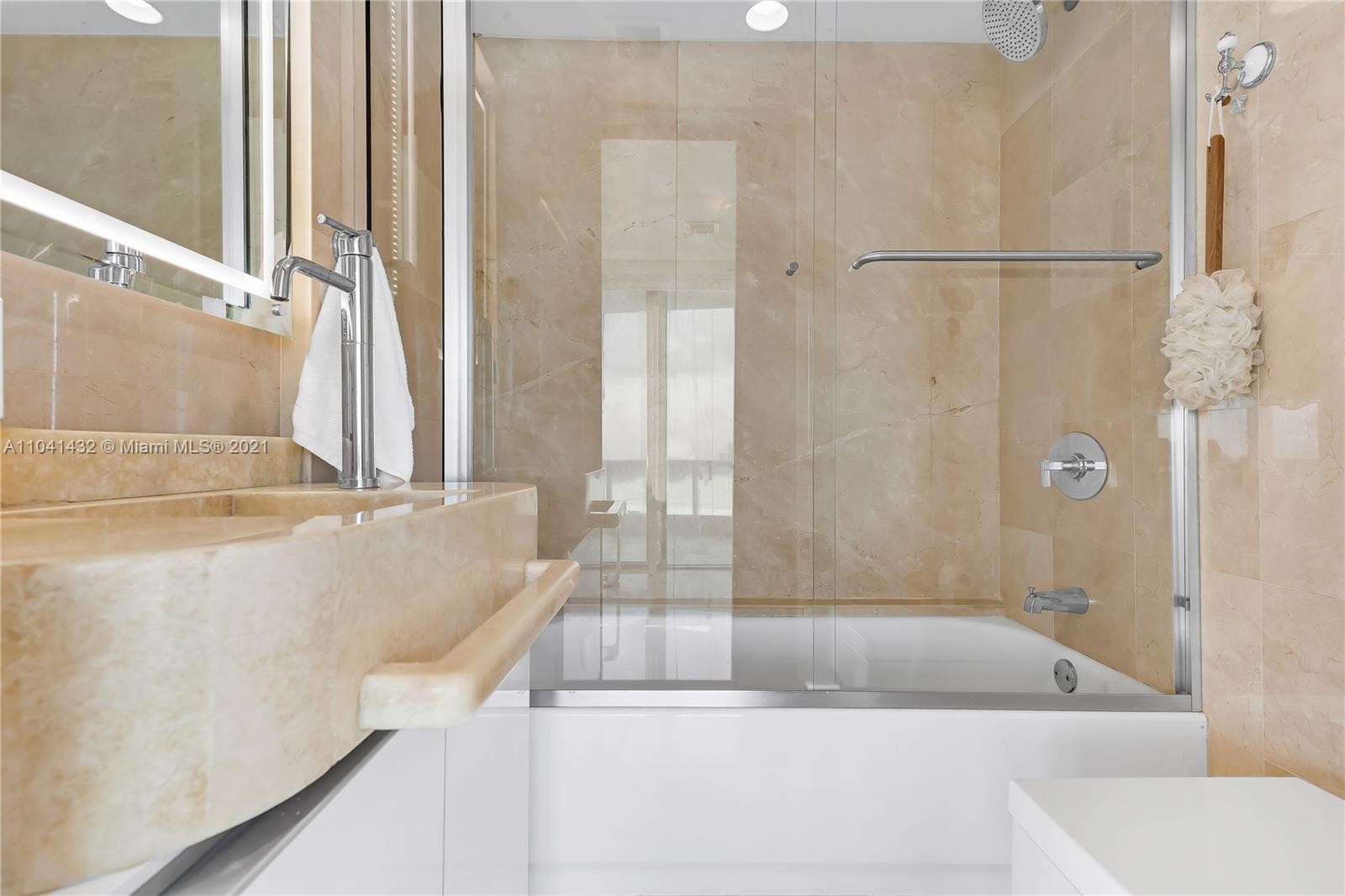 900 Biscayne Boulevard, Unit 6301 Miami, FL 33132 - Photo 42 of 72 a bathroom with a bathtub and a shower